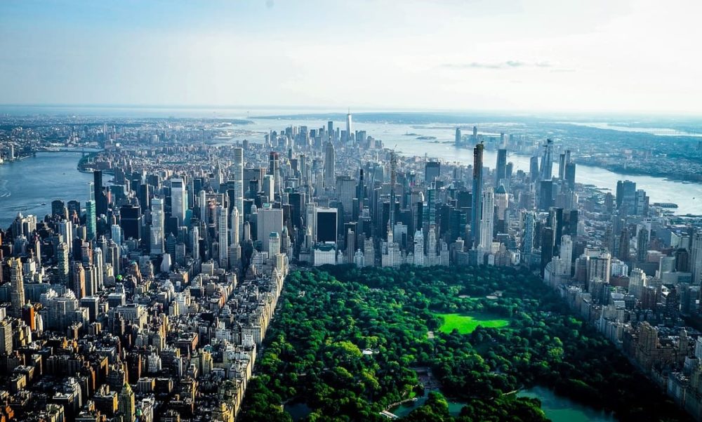 Verdant Central Park on Manhattan, surrounded by towering skyscrapers