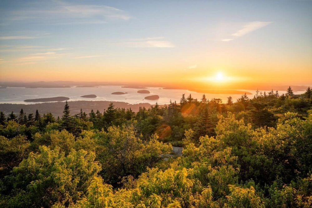 Golden view from Cadillac Mountain in Acadia National Park showing surrounding waters and islands