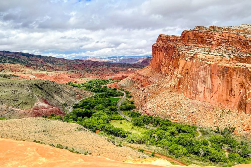The green Fruita settlement surrounded by cliffs in Capitol Reef National Park, Utah