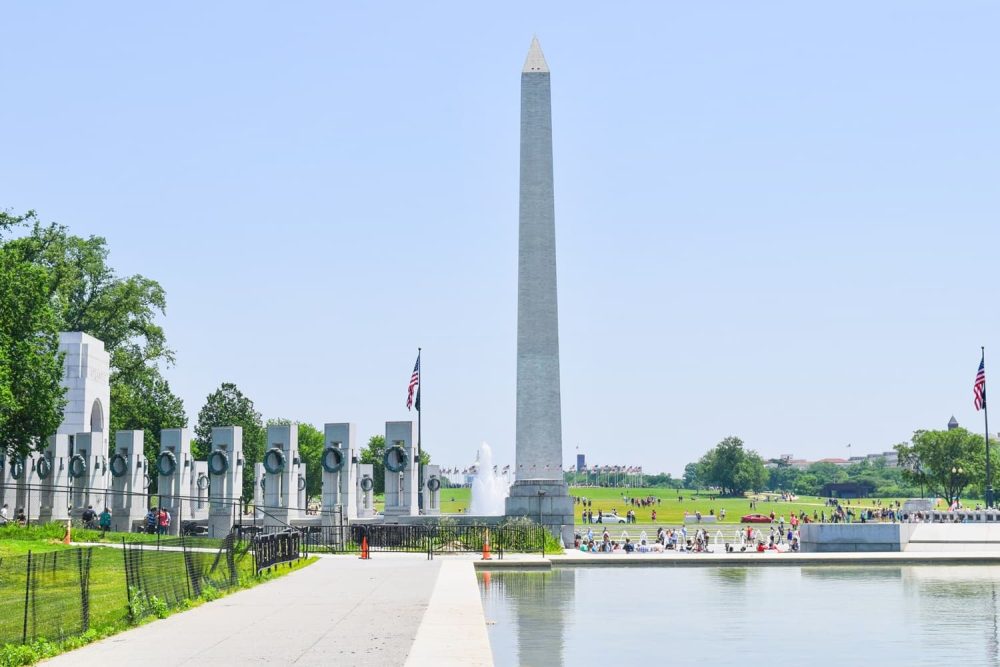The glittering Washington Monument shooting up towards a blue sky