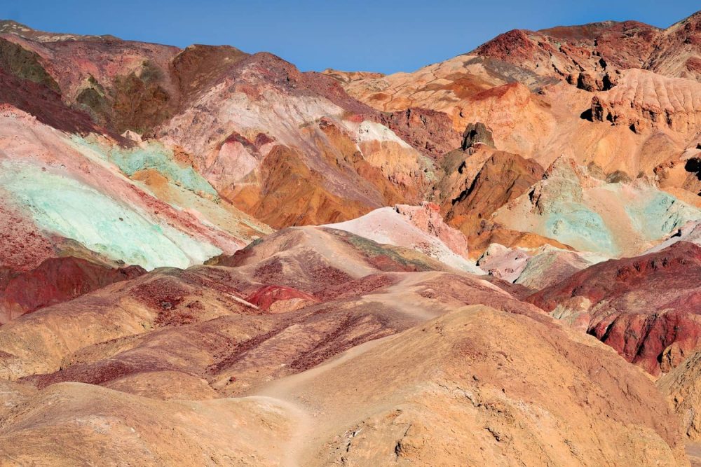 Trail leading to hills splashed with pastel color at Artist’s Palette