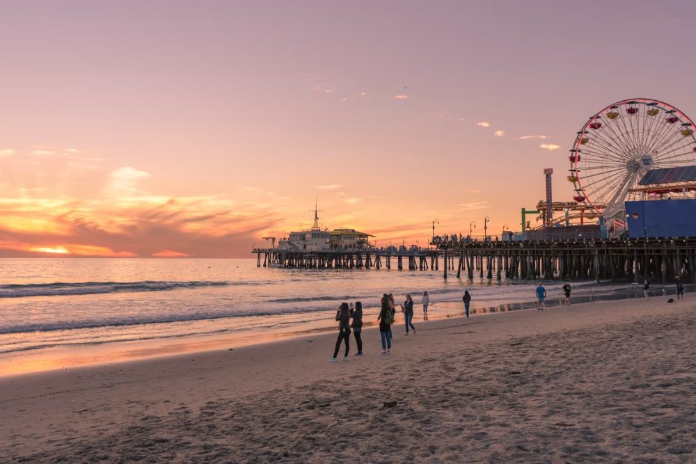 People enjoying the sunset at the Santa Monica Pier, Los Angeles
