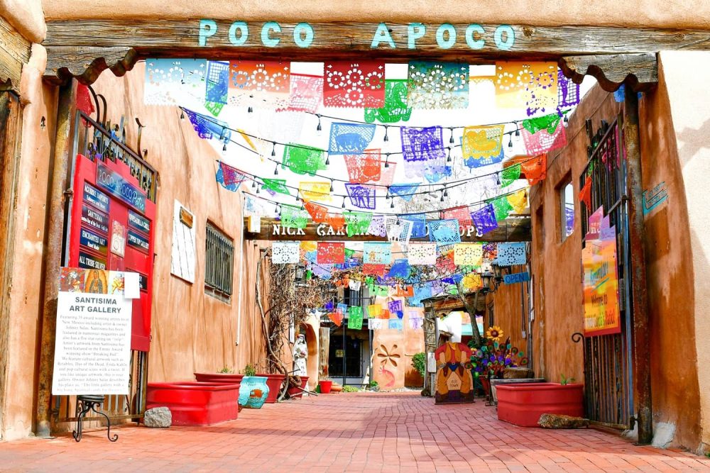 Open gate leading into a narrow pathway in Old Town, Albuquerque